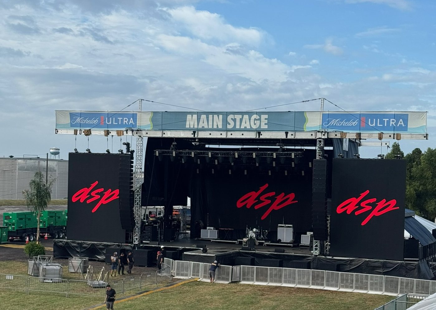 Festival main stage with DSP banners and daytime crowd