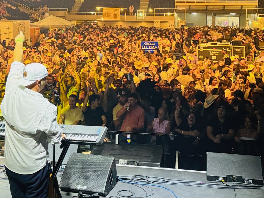 Arena crowd in gold light