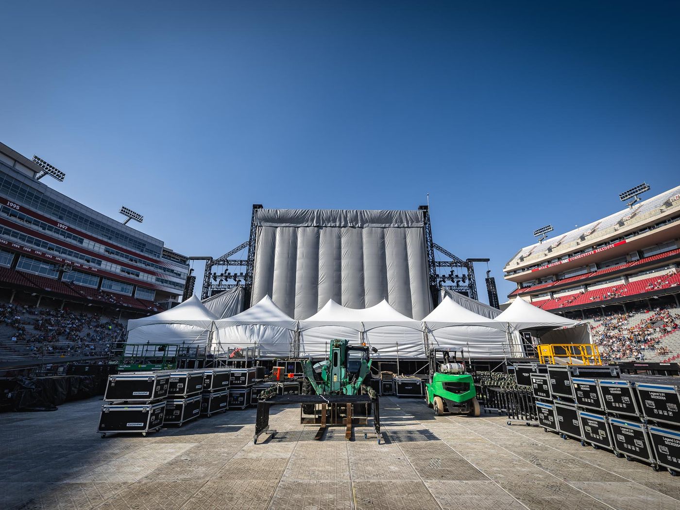 Stage deck load-in on a stadium field