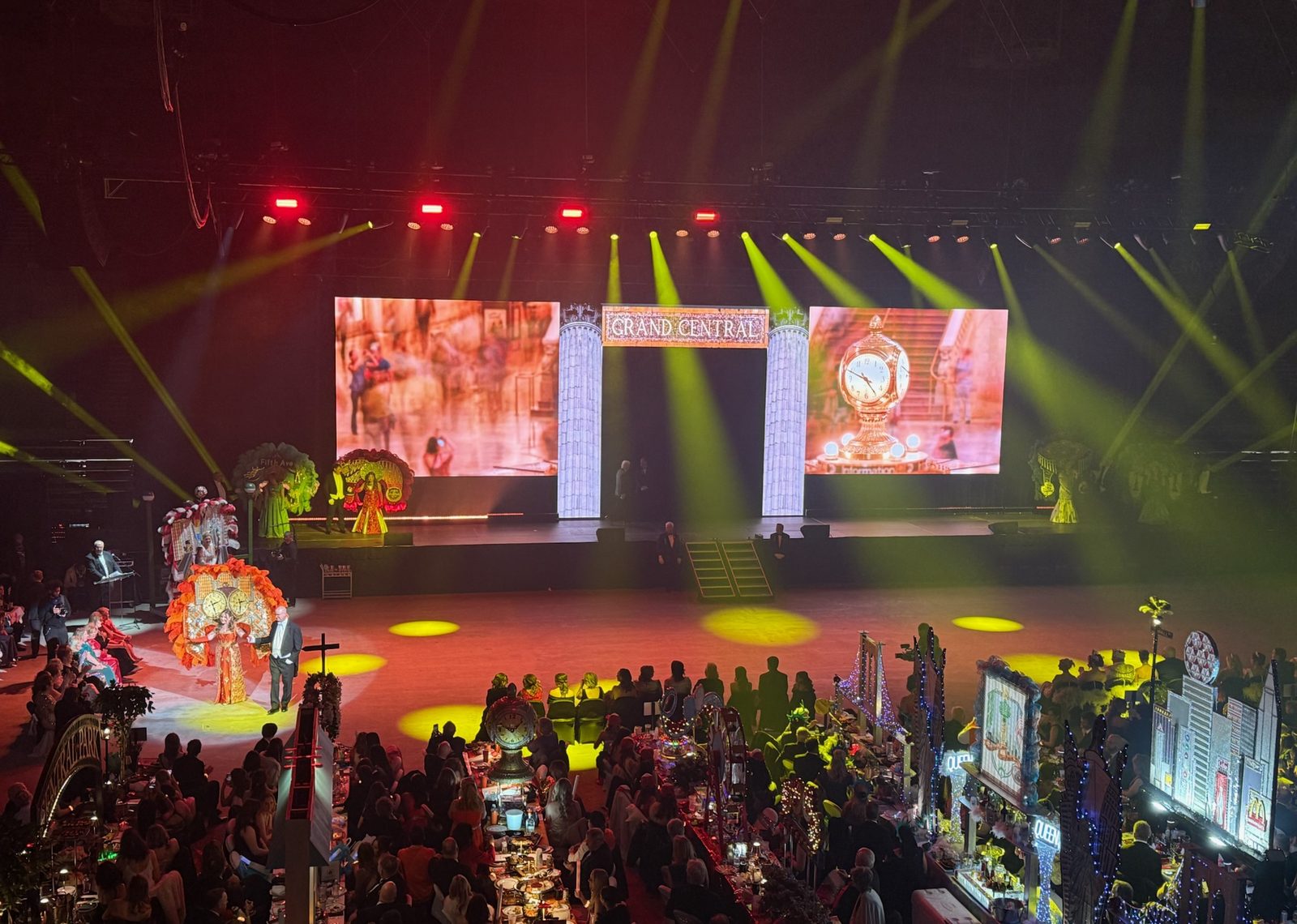Performance on a gala stage above banquet tables