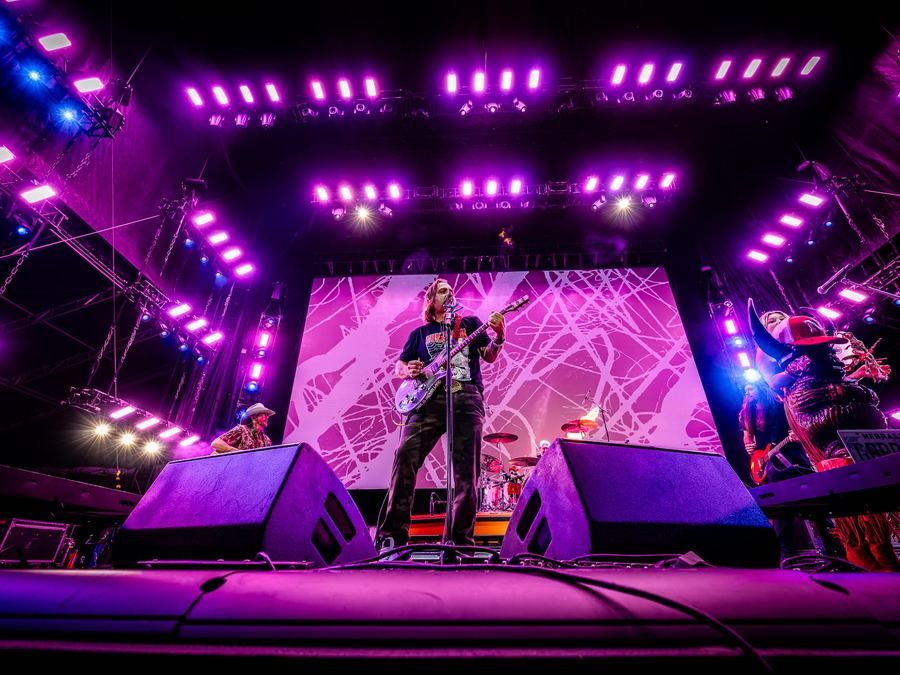 Performer in a magenta wash