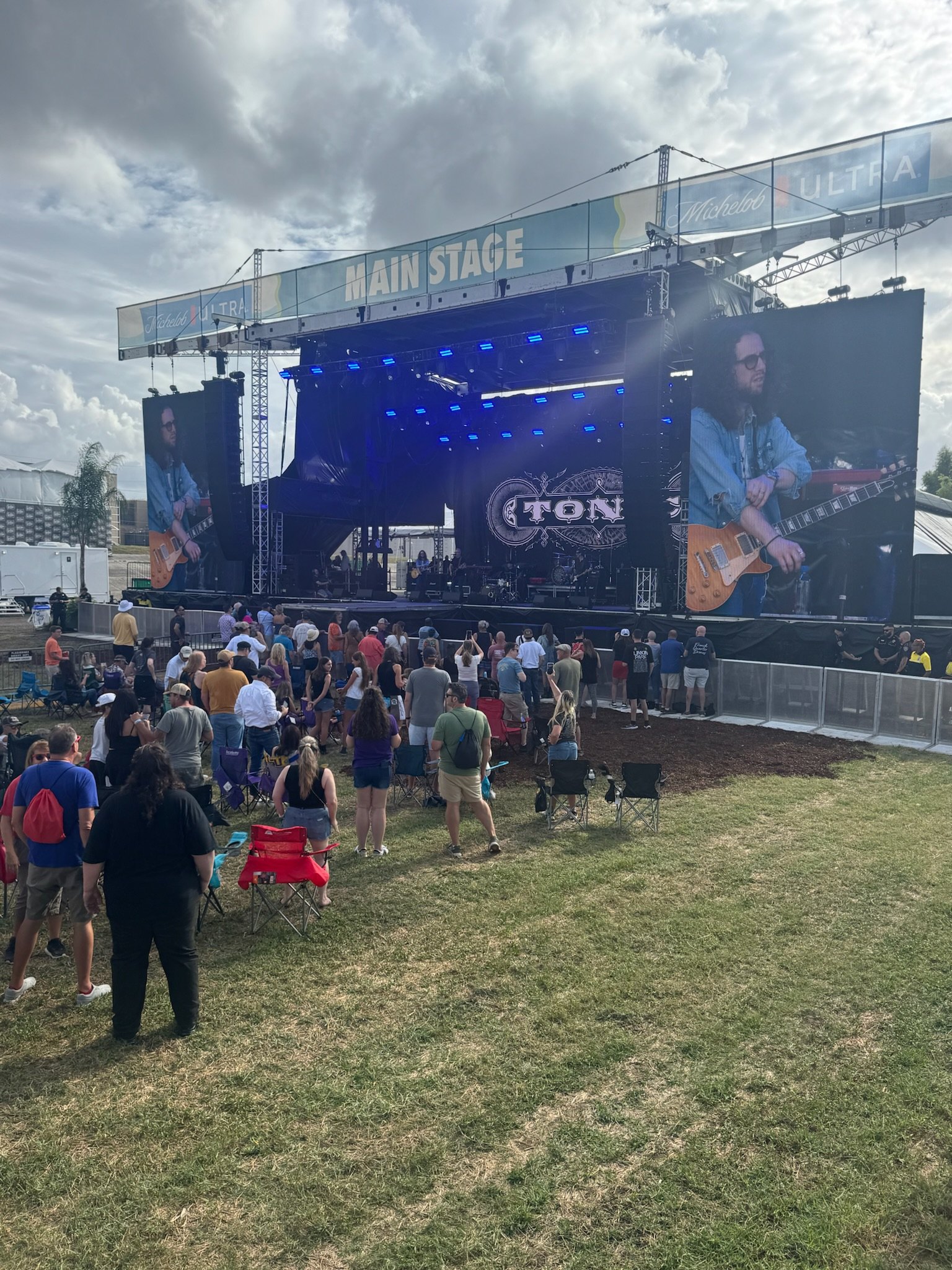 Festival site with perimeter fencing and vendor rows, Deep South Productions