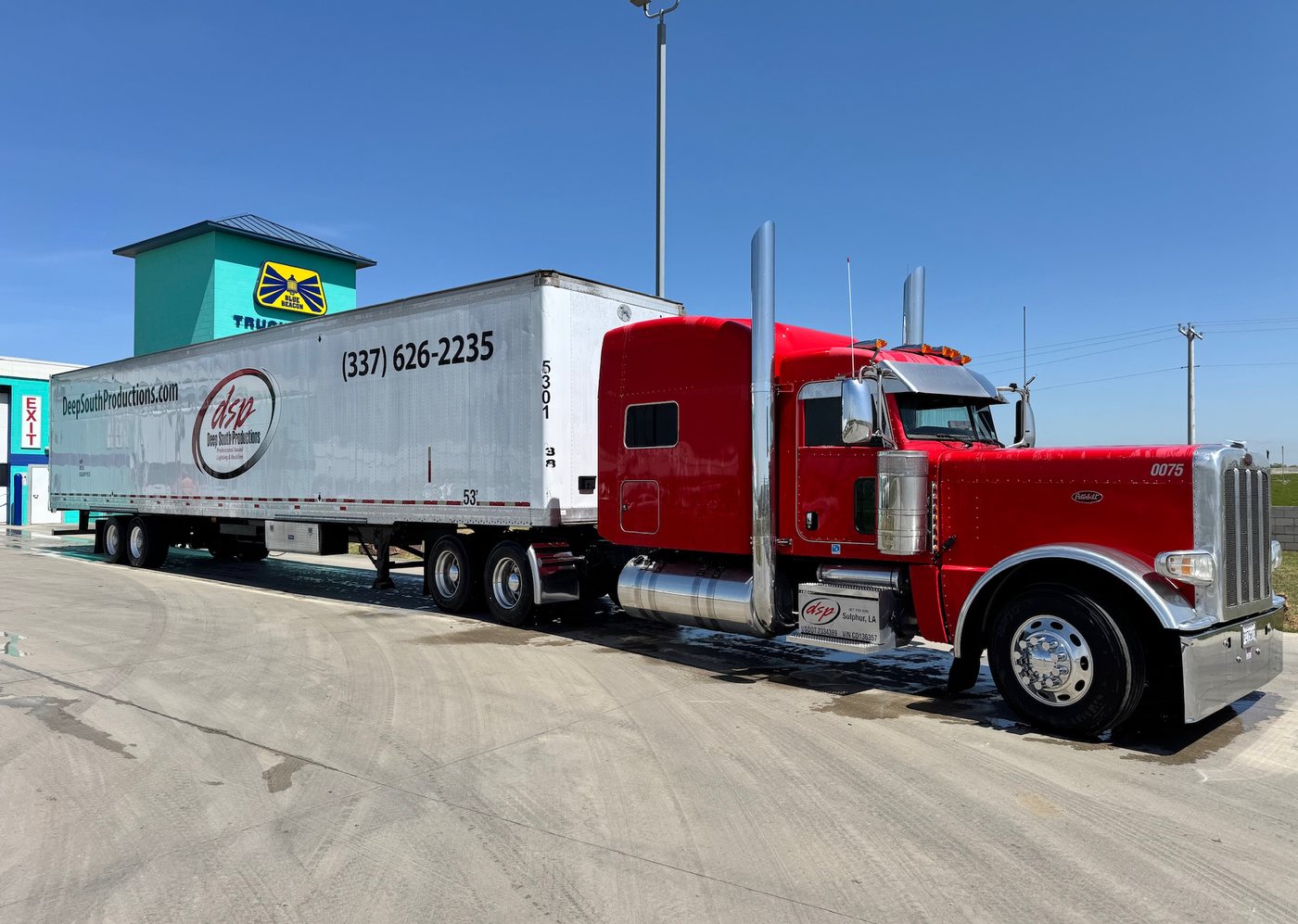 DSP Peterbilt and trailer on the road between tour dates