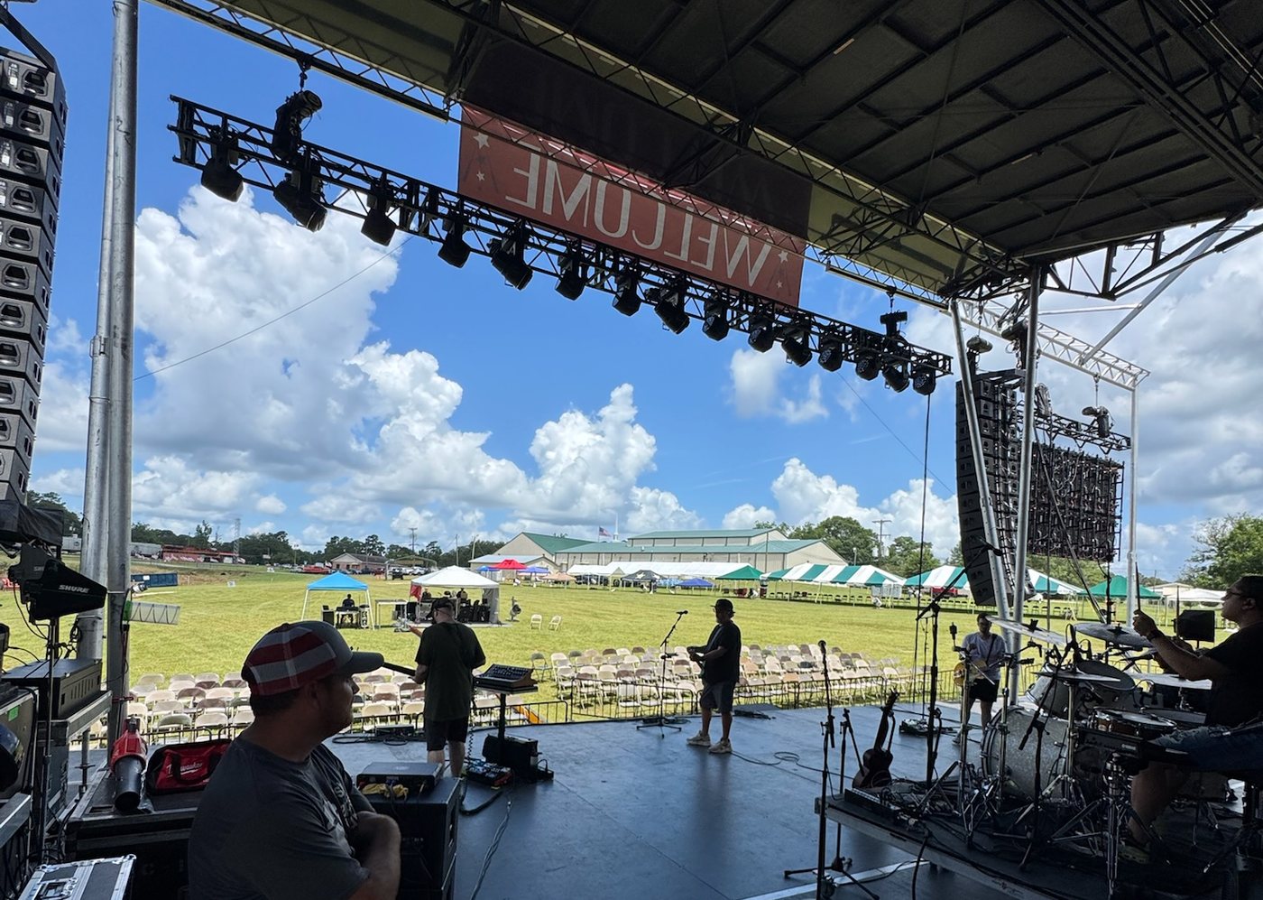 Deep South Productions crew working side stage during a load-in